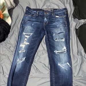 Dark blue ripped jeans